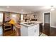 Open living room with a kitchen island, wood floors, and plenty of space for relaxing and entertaining at 3224 Canary Ct, Decatur, GA 30032