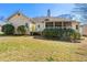 View of back of home with screened in porch and large backyard at 3710 Glen Ian Dr, Loganville, GA 30052