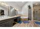 This primary bathroom includes a double vanity, soaking tub, shower, and stylish gray cabinets at 3710 Glen Ian Dr, Loganville, GA 30052