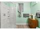 Cozy bathroom features a stand up shower, decorative cabinet, and neutral tones at 3710 Glen Ian Dr, Loganville, GA 30052