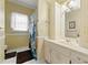 Charming bathroom with classic fixtures, vanity, and shower with curtain at 3710 Glen Ian Dr, Loganville, GA 30052