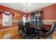 Elegant dining room with hardwood floors, sophisticated decor, and a chandelier at 3710 Glen Ian Dr, Loganville, GA 30052
