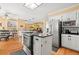 Open kitchen featuring an island, stainless steel appliances, and seamless flow into the breakfast area at 3710 Glen Ian Dr, Loganville, GA 30052