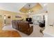 Bright living room with comfortable seating, stone fireplace, and sliding glass doors leading to the outdoors at 3710 Glen Ian Dr, Loganville, GA 30052