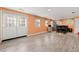 Bright living room features vinyl floors and walkout to backyard at 3710 Glen Ian Dr, Loganville, GA 30052