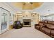 Inviting living room features a fireplace, built-in bookshelves, and access to the kitchen at 3710 Glen Ian Dr, Loganville, GA 30052