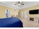 Spacious main bedroom boasts a tray ceiling, neutral walls, and carpet floors at 3710 Glen Ian Dr, Loganville, GA 30052