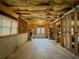 Spacious unfinished basement with walkout access, exposed beams, and ample natural light at 1320 Kildare Ct, Snellville, GA 30078