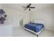 Bright bedroom with a bed, ceiling fan, and closet, offering a peaceful retreat at 1320 Kildare Ct, Snellville, GA 30078