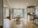 The dining area features hardwood floors, lots of windows, and a view into the kitchen at 1320 Kildare Ct, Snellville, GA 30078