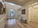 Inviting foyer featuring pristine hardwood floors, a statement bench, and plenty of natural light at 1320 Kildare Ct, Snellville, GA 30078