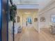 Bright foyer featuring hardwood floors, high ceilings, and elegant decor with views into other living spaces at 1320 Kildare Ct, Snellville, GA 30078