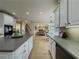 Large kitchen with a view to the living room, stairs, and dining area at 1320 Kildare Ct, Snellville, GA 30078