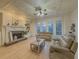 Cozy living room boasting hardwood floors, a coffered ceiling, and many windows at 1320 Kildare Ct, Snellville, GA 30078
