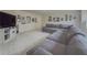 Comfortable living room featuring a large sectional sofa, carpet, and media center at 1320 Kildare Ct, Snellville, GA 30078