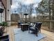 Outdoor patio with comfortable seating, a fire pit, and decorative string lights at 1320 Kildare Ct, Snellville, GA 30078