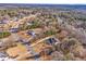 Aerial view of a community showcasing lush greenery, expansive lots, and beautiful homes at 2148 Ne Indian Shoals Dr, Loganville, GA 30052