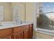 Bathroom featuring a window that provides natural light at 2148 Ne Indian Shoals Dr, Loganville, GA 30052