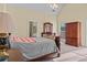 Cozy bedroom features a sitting area, ensuite bath and natural light at 2148 Ne Indian Shoals Dr, Loganville, GA 30052