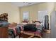 Bedroom features two twin beds and bright natural light from two windows with blinds at 2148 Ne Indian Shoals Dr, Loganville, GA 30052