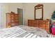 Bedroom features furniture and natural light from two windows with sunshine streaming in at 2148 Ne Indian Shoals Dr, Loganville, GA 30052