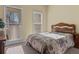 Bedroom features a queen-sized bed and two windows providing ample natural light at 2148 Ne Indian Shoals Dr, Loganville, GA 30052