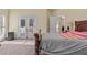 Bedroom features a door to the balcony and a seating area at 2148 Ne Indian Shoals Dr, Loganville, GA 30052