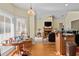 Sunny breakfast nook featuring large windows and adjacent kitchen at 2148 Ne Indian Shoals Dr, Loganville, GA 30052