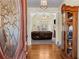 Inviting entryway with hardwood floors, decorative glass door, and elegant chandelier at 2148 Ne Indian Shoals Dr, Loganville, GA 30052