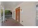 Charming front porch with wooden floor, ornate front door, and classic design details at 2148 Ne Indian Shoals Dr, Loganville, GA 30052