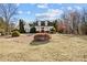 Charming home with a well-maintained front yard, mature trees, and inviting curb appeal at 2148 Ne Indian Shoals Dr, Loganville, GA 30052