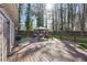 Spacious back deck offers an outdoor seating area and lush green surroundings at 2350 Brenda Se Dr, Smyrna, GA 30080