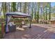 Spacious back deck with outdoor seating, a gazebo, and a grill perfect for entertaining guests at 2350 Brenda Se Dr, Smyrna, GA 30080