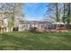 Spacious backyard with a gazebo, wooden deck, and lush green lawn at 2350 Brenda Se Dr, Smyrna, GA 30080
