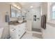 Updated bathroom with walk-in shower, white vanity, granite countertop, and modern fixtures at 2350 Brenda Se Dr, Smyrna, GA 30080
