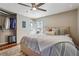 Bright bedroom featuring a ceiling fan, natural light, and a closet for storage and organization at 2350 Brenda Se Dr, Smyrna, GA 30080