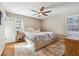 Comfortable bedroom features a ceiling fan, natural light, and a relaxing space for rest and rejuvenation at 2350 Brenda Se Dr, Smyrna, GA 30080