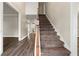 Bright foyer with hardwood floors and a staircase leading to the second floor, creating a grand entrance at 5215 Willow Creek Overlook, Woodstock, GA 30188