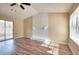 Bright living room with wood floors, unique fireplace, ceiling fan and sliding glass doors to deck at 653 Inland Way, Lilburn, GA 30047