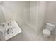 Bathroom featuring double sink vanity, shower-tub combo, and tiled floor at 107 Red Barn Ln, Acworth, GA 30102