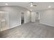 Spacious primary bedroom with a modern ceiling fan, carpet, and multiple closets at 107 Red Barn Ln, Acworth, GA 30102