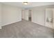 Spacious bedroom with neutral walls, carpet, and access to an en-suite bathroom at 107 Red Barn Ln, Acworth, GA 30102
