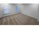 Bedroom with neutral carpet, two windows, and freshly painted walls at 107 Red Barn Ln, Acworth, GA 30102