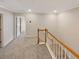 Second floor hallway with natural light and wood railing at 107 Red Barn Ln, Acworth, GA 30102