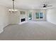 Spacious living room featuring a fireplace and neutral gray carpet at 107 Red Barn Ln, Acworth, GA 30102