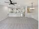 Open-concept living space featuring a modern kitchen with a large island and updated lighting at 107 Red Barn Ln, Acworth, GA 30102