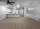 Open-concept living space featuring a modern kitchen with a large island and updated lighting at 107 Red Barn Ln, Acworth, GA 30102