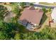 Aerial shot of the home, showcasing a large backyard with mature trees and landscaping at 1119 Simonton Glen Way, Lawrenceville, GA 30045