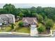 Beautiful home with manicured lawn, mature trees, and a traditional brick facade at 1119 Simonton Glen Way, Lawrenceville, GA 30045