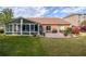 Lovely brick home featuring a screened in porch and brick patio, all overlooking a beautifully landscaped backyard at 1119 Simonton Glen Way, Lawrenceville, GA 30045